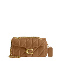 A brown Coach Tabby handbag with a chain strap and gold hardware on a white background.