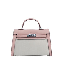 Pink handbag with a silver clasp on a light gray background