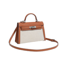 Brown handbag with beige interior on a white background